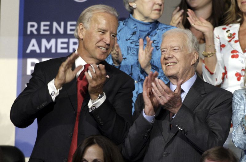 FILE - Sen. Joe Biden and former President Jimmy Carter are seen at the Democratic National Convention in Denver, Aug. 26, 2008. (AP Photo/Paul Sancya, File)