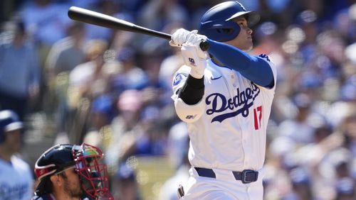 Los Angeles Dodgers designated hitter Shohei Ohtani (17) hits a home run during the eighth inning of a baseball game against the Atlanta Braves in Los Angeles, Sunday, May 5, 2024. (AP Photo/Ashley Landis)