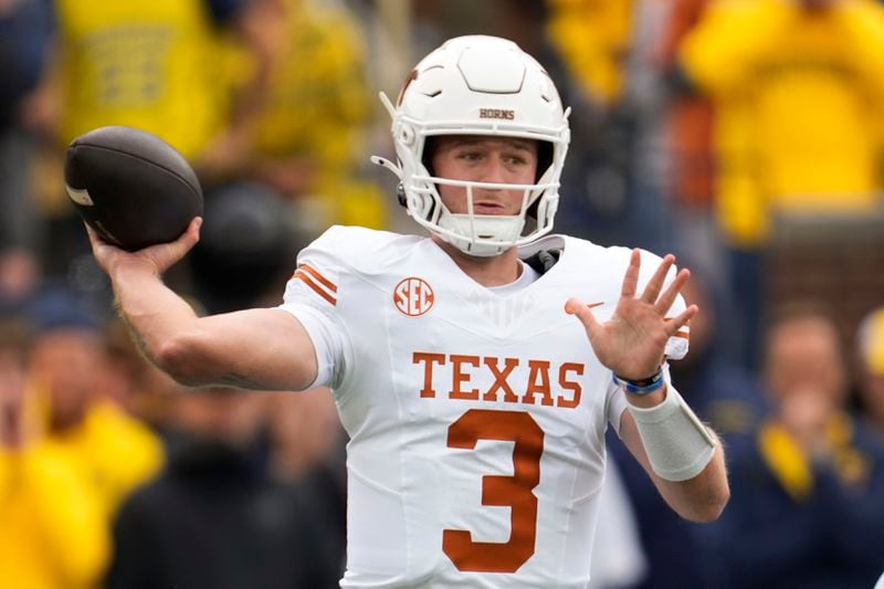 Texas quarterback Quinn Ewers throws against Michigan in the first half of an NCAA college football game in Ann Arbor, Mich., Saturday, Sept. 7, 2024. (AP Photo/Paul Sancya)