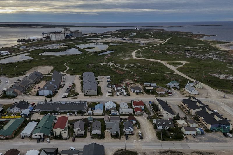 A grain port, top left, stands on the outskirts of town, Wednesday, Aug. 7, 2024, in Churchill, Manitoba. (AP Photo/Joshua A. Bickel)