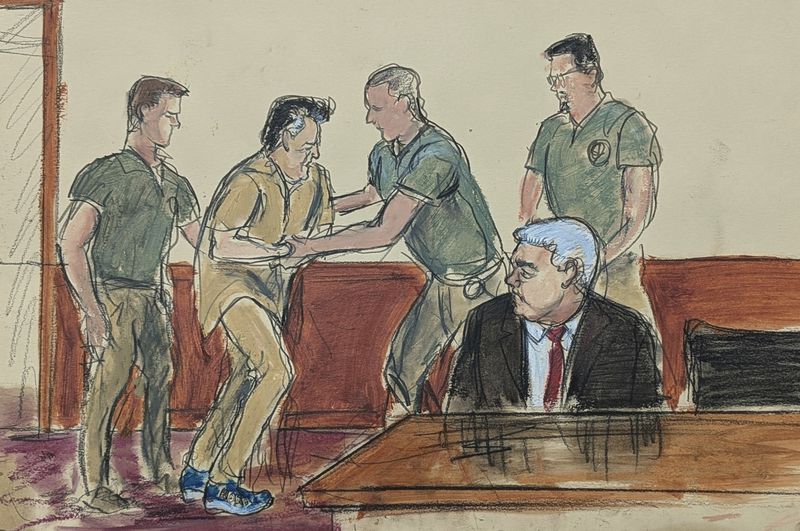 In this courtroom sketch, Ismael “El Mayo” Zambada, second left, assisted by the U.S. Marshals, is led into the courtroom as his defense attorney Frank Perez, seated right, watches in federal court, Friday, Sept. 13, 2024, in the Brooklyn borough of New York,. (Elizabeth Williams via AP)