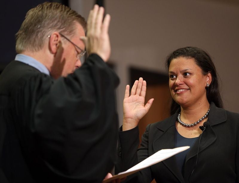Meria Carstarphen is sworn in as the new superintendent of Atlanta Public Schools by Fulton Superior Court Judge Melvin K. Westmoreland on July 7, 2014, at APS headquarters. BEN GRAY / AJC FILE PHOTO