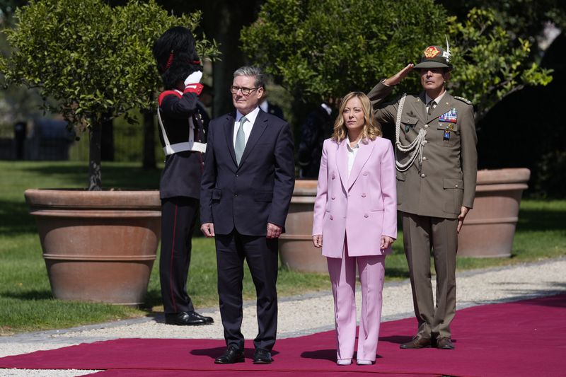 Italian Premier Giorgia Meloni, second from right, welcomes U.K. Prime Minister Keir Starmer as they meet at Villa Panphilj in Rome, Monday, Sept. 16, 2024. U.K. Prime Minister Keir Starmer is meeting Italian Premier Giorgia Meloni in Rome on Monday, as the two very different politicians, from left and right, seek common cause to curb migrants reaching their shores by boat. The visit comes after at least eight seaborne migrants died off the French coast over the weekend. (AP Photo Andrew Medichini)