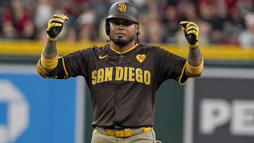 San Diego Padres' Luis Arraez celebrates after his double against the Arizona Diamondbacks during the sixth inning of a baseball game, Sunday, Sept. 29, 2024, in Phoenix. (AP Photo/Darryl Webb)