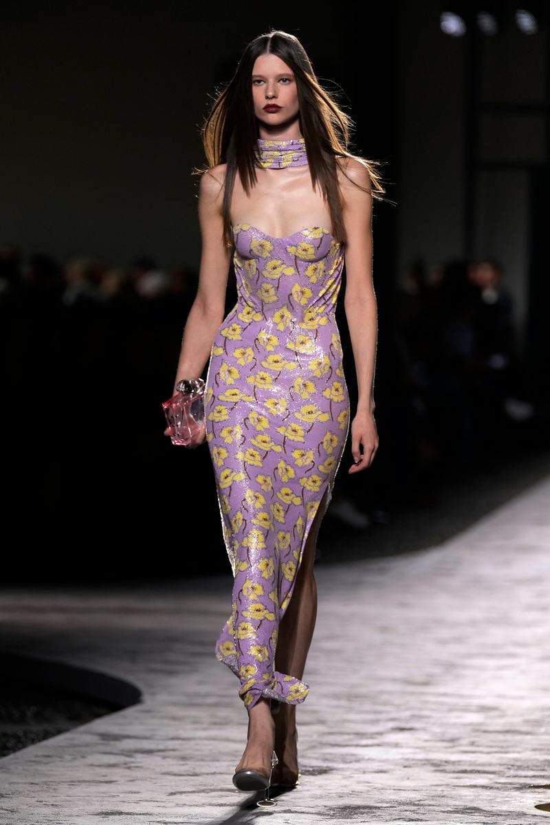 A model wears a creation as part of the Versace Spring Summer 2025 collection, that was presented in Milan, Italy, Friday, Sept. 20, 2024. (AP Photo/Antonio Calanni)