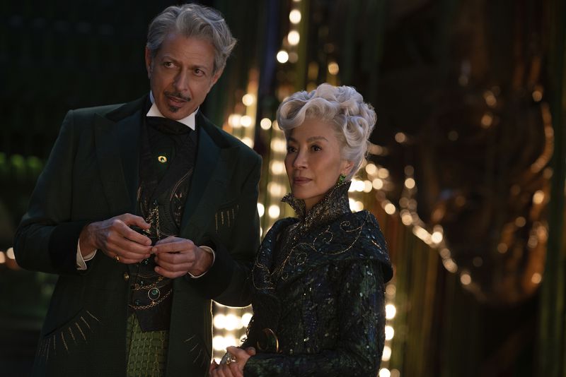 This image released by Universal Pictures shows Jeff Goldblum as The Wizard of Oz, left, and Michelle Yeoh as Madam Morrible in a scene from the film "Wicked." (Universal Pictures via AP)