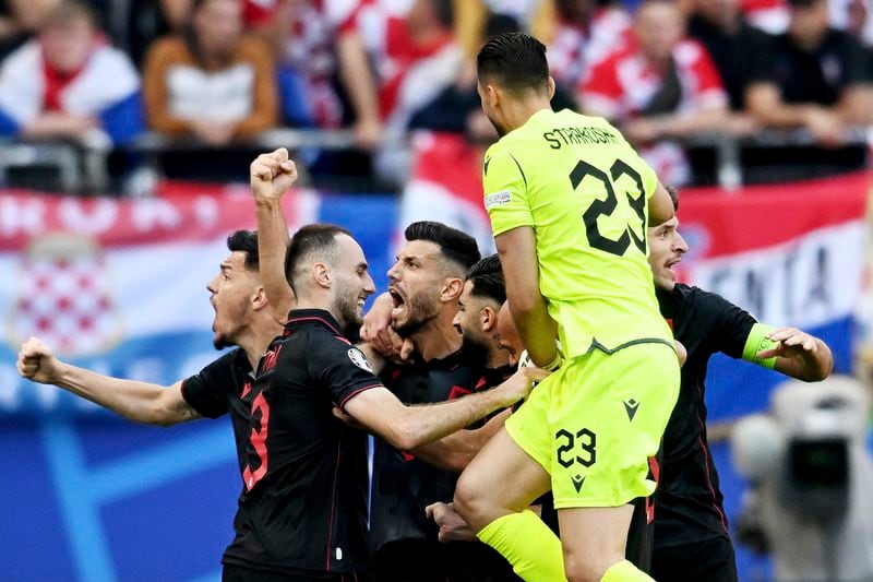 Albania's scorer Klaus Gjasula, third left, and his teammates celebrate their side's second goal during a Group B match between Croatia and Albania at the Euro 2024 soccer tournament in Hamburg, Germany, Wednesday, June 19, 2024. (Sina Schuldt/dpa via AP)