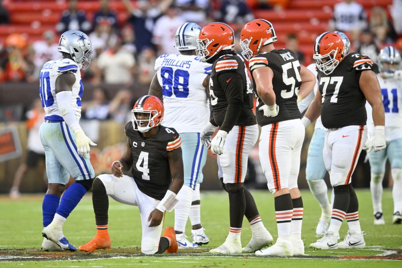 Cleveland Browns' Deshaun Watson (4) recovers after throwing an incomplete pass in the second half of an NFL football game against the Dallas Cowboys in Cleveland, Sunday, Sept. 8, 2024. (AP Photo/David Richard)