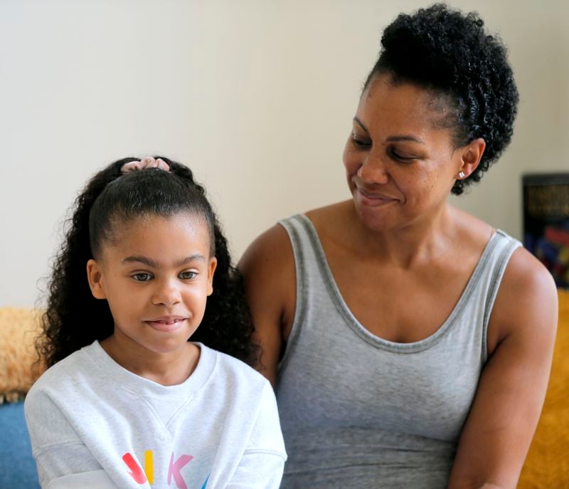 Ayra Murphy, 9, speaks during an interview while her mother April Murphy looks on at her home in Suwanee on Monday, July 12, 2021. Ayra Murphy was placed in a gifted education program two years ago at Sycamore Elementary. (Christine Tannous / christine.tannous@ajc.com)