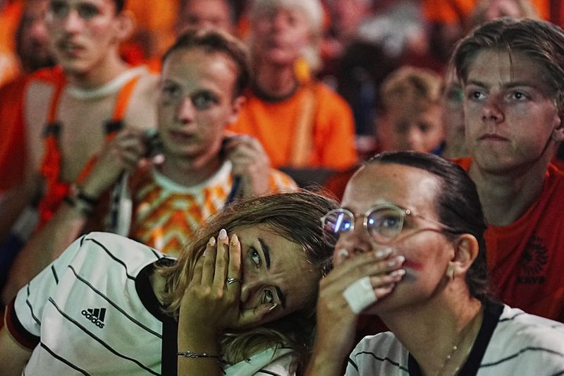 Netherlands soccer fans react at a pubic screening at the end of a semi final match between Netherlands and England at the Euro 2024 soccer tournament in Dortmund, Germany, Wednesday, July 10, 2024. (AP Photo/Markus Schreiber)