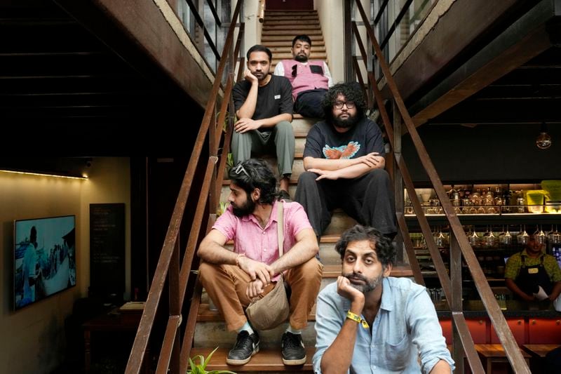 From bottom to top, Suryakant Sawhney, Rohit Gupta, Kartik Pillai, Dhruv Bhola and Karan Singh of Peter Cat Recording Co pose for a photograph in Mumbai, India, Friday, Aug. 2, 2024. (AP Photo/Rajanish Kakade)