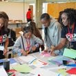 NOMA Atlanta member Crysta Hailes (left) and chapter President Tulia Scott work with students during the 2024 summer camp at Georgia Tech. Courtesy