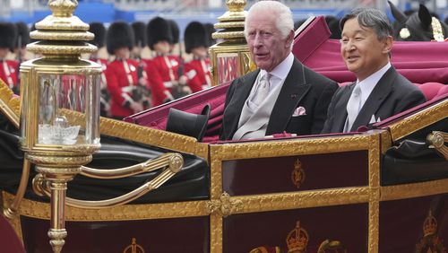 FILE - Britain's King Charles III, left and Japans Emperor Naruhito ride in a one carriage during the ceremonial welcome for the State Visit to Britain of the Emperor and Empress, in London, Tuesday, June 25, 2024. Naruhito and the Empress Masako, who studied at Oxford a few years after her husband, wrapped up a weeklong trip to Britain on Friday. Their itinerary combined the glitter and ceremony of a state visit with four days of less formal events that gave the royal couple an opportunity to revisit their personal connections to Britain. (AP Photo/Kin Cheung, Pool, File)