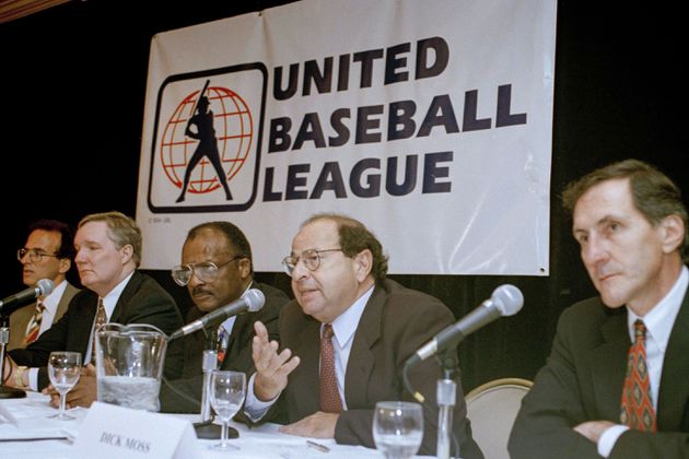 FILE - Agent Dick Moss, second from right, Donald Fehr's predecessor as general counsel of the Major League Players Association, answers a question at a New York news conference, Nov. 1, 1994, announcing the formation of the United Baseball League. From left are Smith College economics professor Andrew Zimbalist; Rep. John Bryant, D-Texas; former major leaguer Curt Flood; Moss, and Robert Mrazek. (AP Photo/Marty Lederhandler, File)