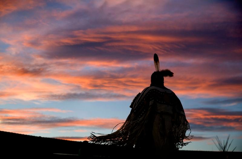 FILE - In this July 13, 2018, file photo, a woman performs a traditional Native American dance during the North American Indian Days celebration on the Blackfeet Indian Reservation in Browning, Mont. Many Native Americans thought a bitter debate over the U.S. capital’s football mascot was over when the team became the Washington Commanders. The original logo was designed by a member of the Blackfeet Nation. Now a white Republican U.S. senator from Montana is reviving the debate by blocking a bill funding the revitalization of the team's stadium unless the NFL and the Commanders bring back the former logo in some form. (AP Photo/David Goldman, File)