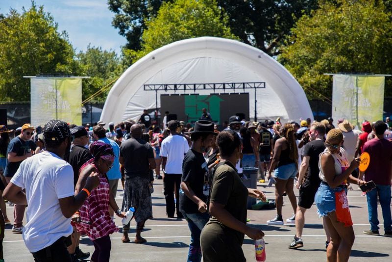 The crowd line dances at House in the Park in 2023.