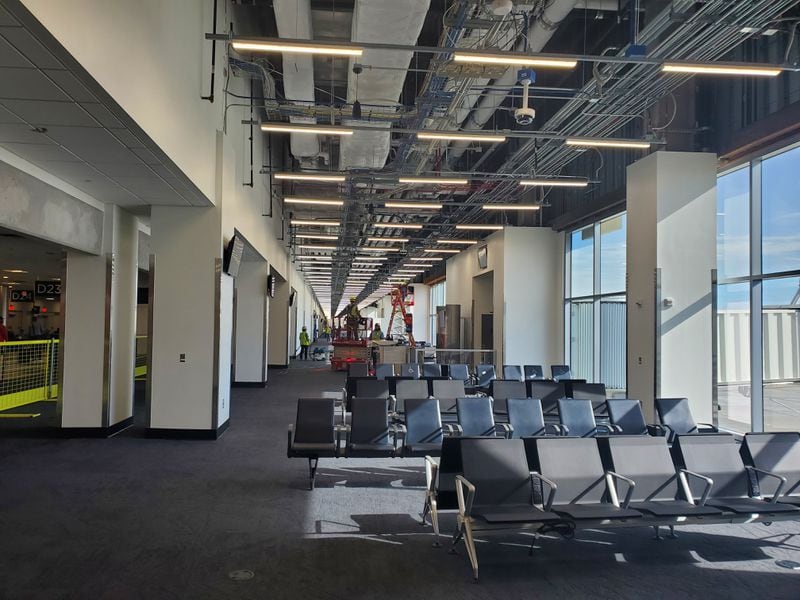 At Hartsfield-Jackson International Airport, workers put the finishing touches on gate areas to complete the first phase of a project to widen Concourse D on Sept. 4, 2024. (Courtesy)