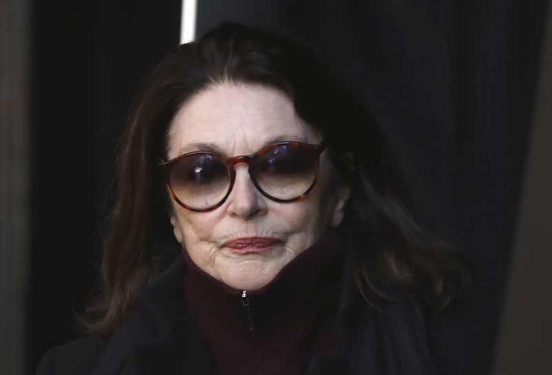 FILE - French actress Anouk Aimee arrives at La Madeleine Church prior to the funeral ceremony to late French rock singer Johnny Hallyday Saturday Dec. 9, 2017 in Paris. French actress Anouk Aimée, winner of a Golden Globe for her starring role in "A Man and a Woman" by legendary French director Claude Lelouch, has died, her agent said Tuesday. She was 92. (Ludovic Marin, Pool via AP, File)