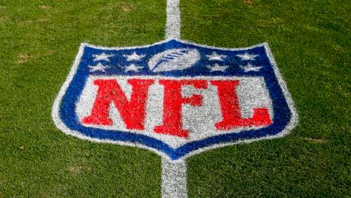 FILE - The NFL logo is displayed on the field at the Bank of American Stadium, Nov. 4, 2018, in Charlotte, N.C. The judge who presided in the class-action lawsuit filed by “Sunday Ticket” subscribers against the NFL said the jury did not follow his instructions in determining damages. (AP Photo/Nell Redmond, File)