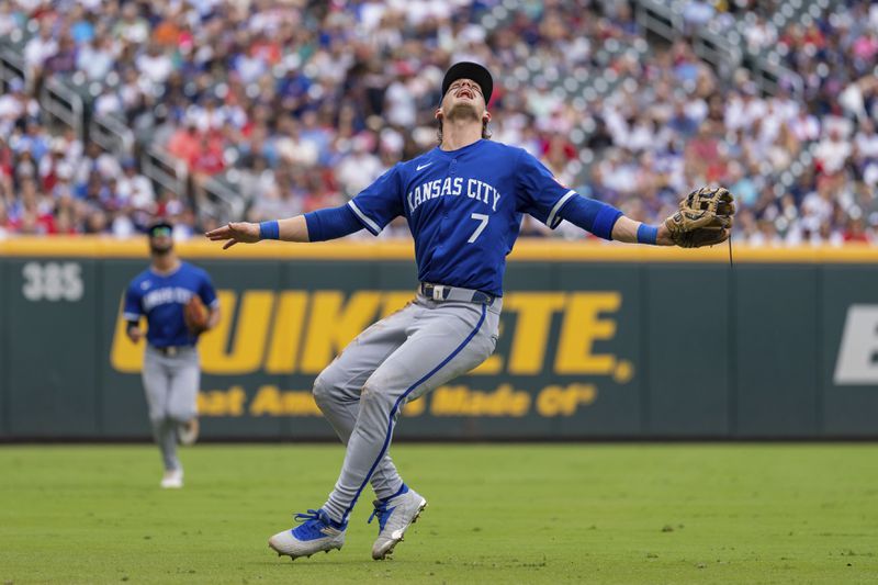 Kansas City Royals shortstop Bobby Witt Jr. (7) waves off teammates to catch a pop fly hit by Atlanta Braves' Matt Olson in the first inning of a baseball game Sunday, Sept. 29, 2024, in Atlanta. (AP Photo/Jason Allen)