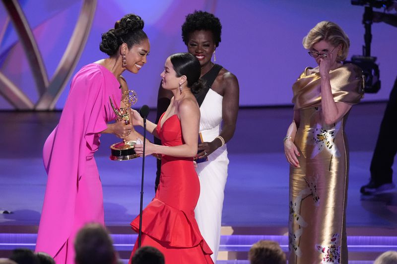 Gina Torres, far left, Viola Davis, center, and Christine Baranski present the award for outstanding lead actress in a drama series to Anna Sawai for "Shogun" during the 76th Primetime Emmy Awards on Sunday, Sept. 15, 2024, at the Peacock Theater in Los Angeles. (AP Photo/Chris Pizzello)