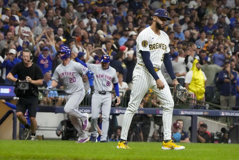 Milwaukee Brewers pitcher Devin Williams reacts after giving up a three-run home run to New York Mets' Pete Alonso during the ninth inning of Game 3 of a National League wild card baseball game Thursday, Oct. 3, 2024, in Milwaukee. (AP Photo/Morry Gash)