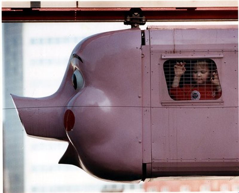 A youngster rides The Pink Pig in this 1990 file photo.