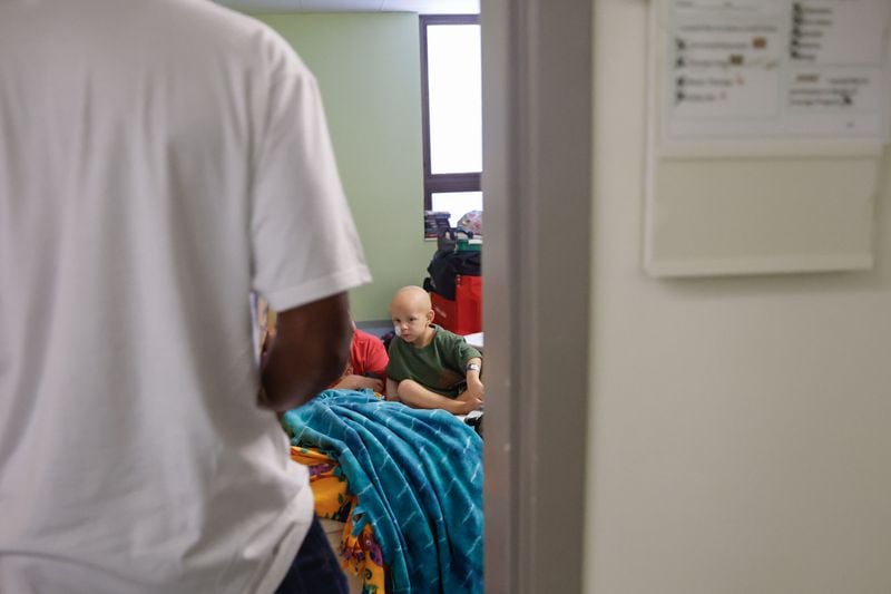 Pro and College Football Hall of Famer Champ Bailey walks into the room of Brayden Guy, 3, while visiting patients at Children’s Healthcare of Atlanta Egleston on Tuesday, Aug. 27, 2024. (Natrice Miller/AJC)