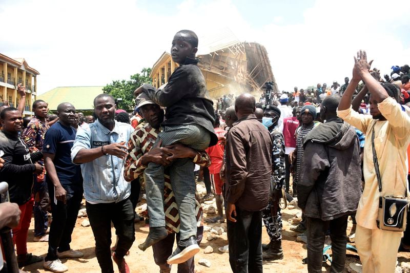 A student is rescued from the rubble of a collapsed two-storey building in Jos, Nigeria, Friday, July, 12, 2024. At least 12 students have been killed after a school building collapsed and trapped them in northern Nigeria, authorities said on Friday. (AP Photos)