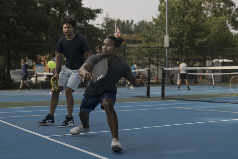 
                        FILE -- Playing pickleball at a park in Arlington, Va., June 28, 2023. If pickleball is your main form of exercise, you may need to augment it. There are moves you need to add to age well and avoid injury. (Alyssa Schukar/The New York Times)
                      