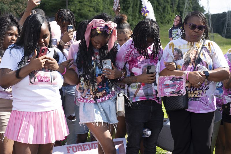 Sharon Williams, right, great aunt of Bre’Asia Powell who was shot and killed a year ago, leads a prayer during a “rally for peace” in her memory in southwest Atlanta on Tuesday, May 28, 2024. (Ben Gray/Ben@BenGray.com)