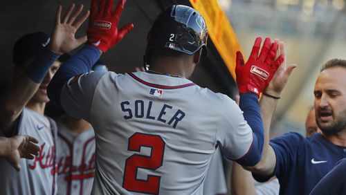 Atlanta Braves' Jorge Soler celebrates his solo home run against the Minnesota Twins in the first inning of a baseball game Wednesday, Aug. 28, 2024, in Minneapolis. (AP Photo/Bruce Kluckhohn)