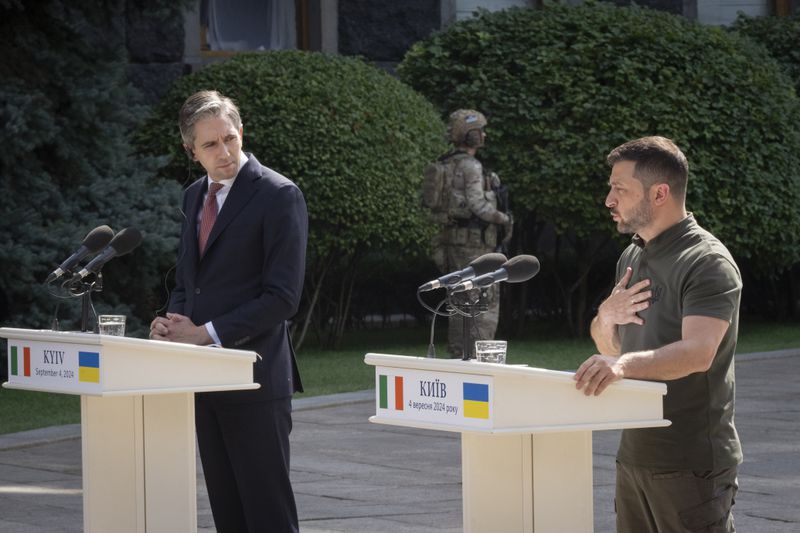 Ukrainian President Volodymyr Zelenskyy, right, talks during his joint press conference with Irish Prime Minister Taoiseach Simon Harris in Kyiv, Ukraine, Wednesday, Sept. 4, 2024. (AP Photo/Efrem Lukatsky)