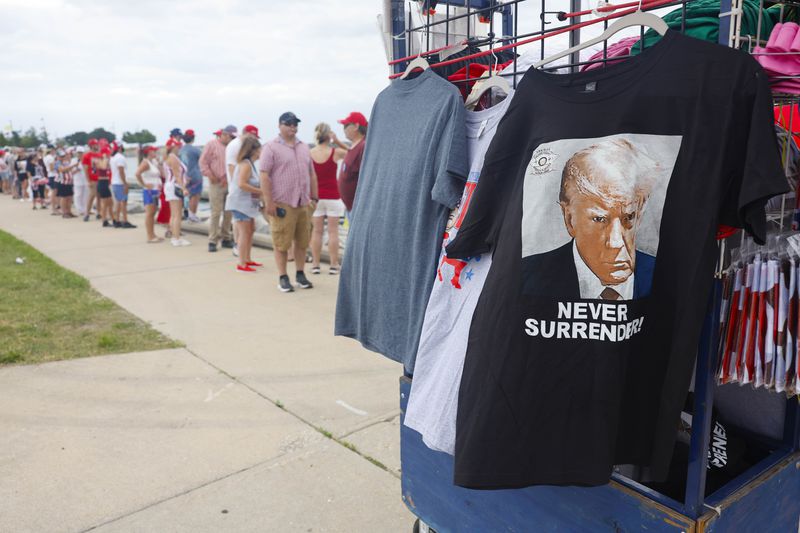 People line up to enter a venue to see Republican presidential candidate former President Donald Trump speak at a campaign event Tuesday, June 18, 2024 in Racine, Wis. (AP Photo/Jeffrey Phelps)