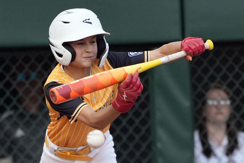 Lake Mary, Fla.'s Hunter Alexander puts down a bunt against Taiwan that scored the winning run during the eighth inning of the Little League World Series Championship game in South Williamsport, Pa., Sunday, Aug. 25, 2024. (AP Photo/Tom E. Puskar)