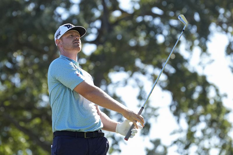 Patrick Fishburn watches his shot from the 10th tee during the third round of the Procore Championship golf tournament at the Silverado Resort North Course, Saturday, Sept. 14, 2024, in Napa, Calif. (AP Photo/Godofredo A. Vásquez)