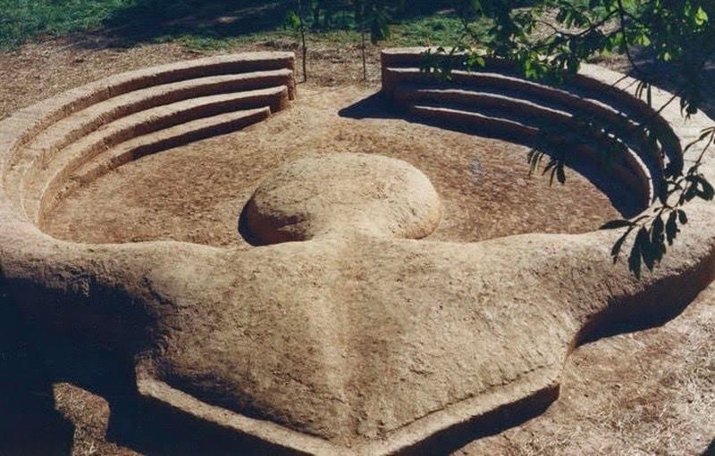 A photograph of "Prima Mater," a rammed-earth public sculpture created by Donna Pickens at ArtsXchange in 1990, is included in the “A Room of Her Own” exhibition.