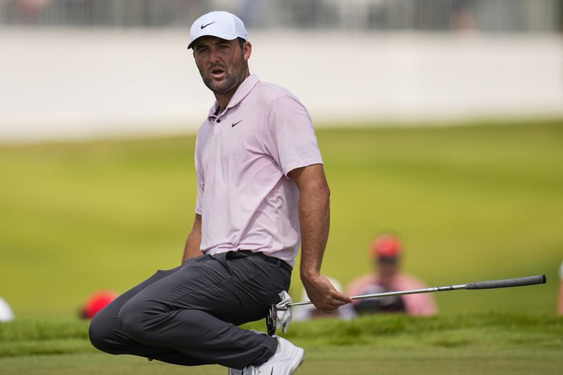 Scottie Scheffler reacts to a missed putt on the fifth green during the second round of the Tour Championship golf tournament, Friday, Aug. 30, 2024, in Atlanta. (AP Photo/Mike Stewart)