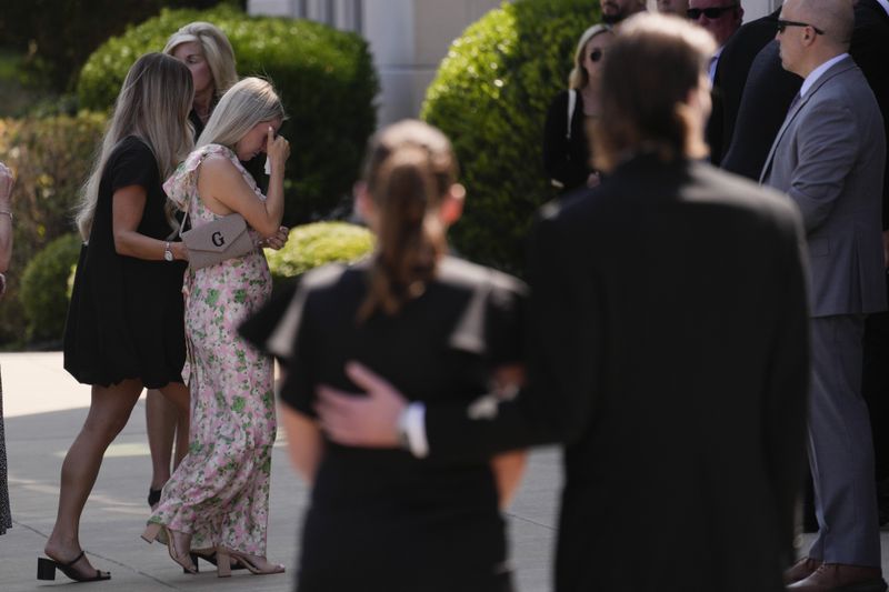 Mourners arrive for a funeral for Columbus Blue Jackets hockey player John Gaudreau and his brother Matthew Gaudreau at St. Mary Magdalen Catholic Church in Media, Pa., Monday, Sept. 9, 2024. (AP Photo/Matt Rourke)