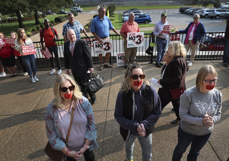 Abortion opponents stand outside the Missouri Supreme Court in Jefferson City, Mo., on Tuesday, Sept. 10, 2024, after the court heard arguments over whether an abortion-rights amendment should go before voters this year. (Robert Cohen/St. Louis Post-Dispatch via AP)