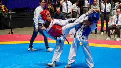 Skylar Hendrix, left, competes in a taekwondo competition earlier this year. (Photo provided by Sydney Adams)