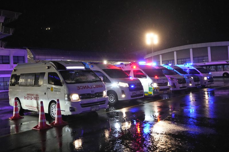Ambulances wait to carry passengers from a London-Singapore flight that encountered severe turbulence, in Bangkok, Thailand, Tuesday, May 21, 2024. The plane apparently plummeted for a number of minutes before it was diverted to Bangkok, where emergency crews rushed to help injured passengers amid stormy weather, Singapore Airlines said Tuesday. (AP Photo/Sakchai Lalit)