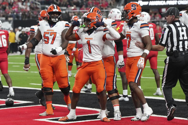 Syracuse running back LeQuint Allen (1) celebrates with teammates after scoring a touchdown against UNLV in the first half during an NCAA college football game, Friday, Oct. 4, 2024, in Las Vegas. (AP Photo/Rick Scuteri)