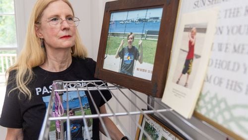 Sharon Winkler looks at photos of her son Alex in her Atlanta home. Winkler is among a group of parents and others fighting what they believes are out-of-control social media sites, memes, and comments that are doing harm to children. In 2017, Winkler's son Alex committed suicide after turning to social media for empathy and advice over a recent break-up with his girlfriend. PHIL SKINNER FOR THE ATLANTA JOURNAL-CONSTITUTION