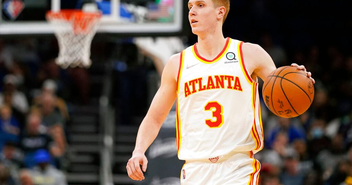 Kevin Huerter of the Atlanta Hawks puts three fingers up during the