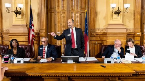 (L-R) Georgia Election Board member Sara Tindall Ghazal, member Janelle King, executive director Mike Coan, chairman John Fervier, member Rick Jeffares, and member Janice Johnston appear before a board meeting at the Capitol in Atlanta on Friday, September 20, 2024. The election board is set to decide on sweeping rule changes less than a month before early voting begins. (Arvin Temkar / AJC)