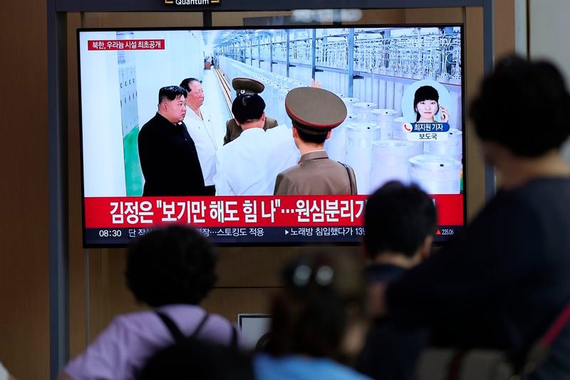 A TV screen shows an image of North Korean leader Kim Jong Un during a news program at the Seoul Railway Station in Seoul, South Korea, Friday, Sept. 13, 2024. The letters on the top read "North Korea, unveiling the uranium enrichment facility for the first time." (AP Photo/Lee Jin-man)