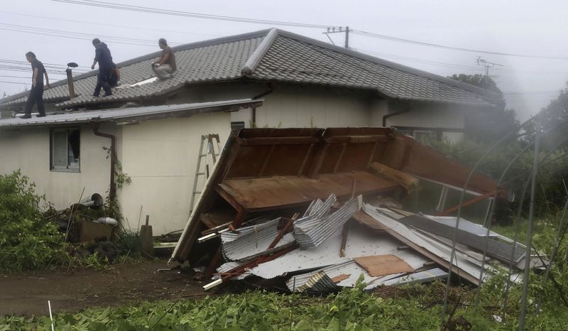 A house is seen damaged as a typhoon is approaching in Miyazaki, Miyazaki prefecture, western Japan, Wednesday, Aug. 28, 2024, as a typhoon is approaching. (Kyodo News via AP)