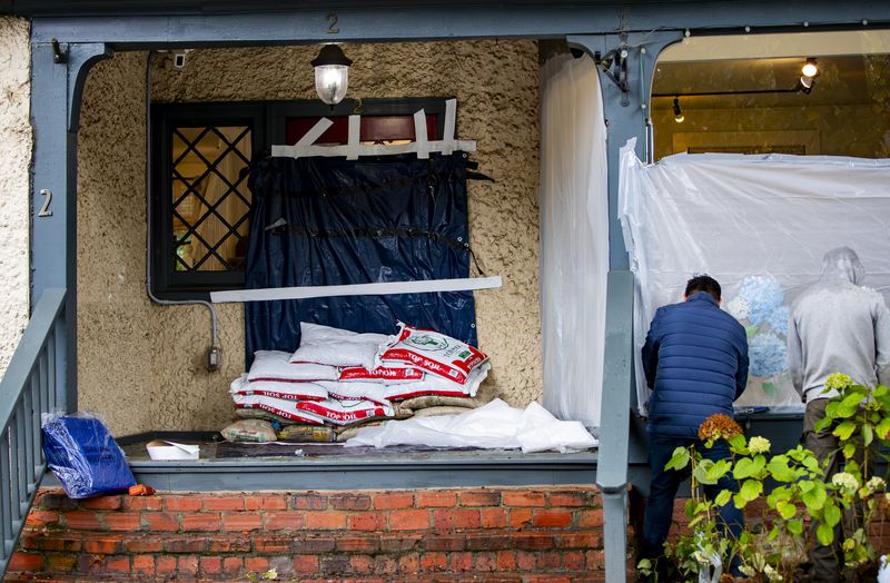 Bette Boutique employees prepare their store for Hurricane Helene in Historic Biltmore Village in Asheville, N.C. on Friday, Sept. 27, 2024. (Josh Bell/The Asheville Citizen-Times via AP)