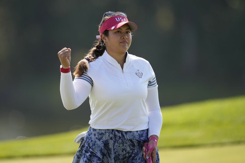 United States' Lilia Vu celebrates after making a putt on the 10th hole during a Solheim Cup golf tournament foursome match at Robert Trent Jones Golf Club, Saturday, Sept. 14, 2024, in Gainesville, Va. (AP Photo/Matt York)